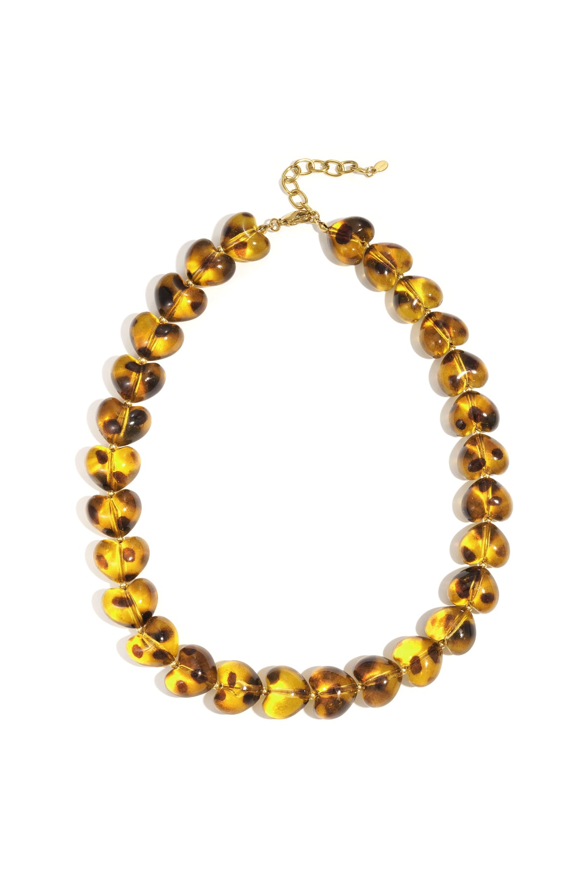 Amber heart-shaped acrylic bead necklace with gold-tone adjustable clasp laid flat on white background
