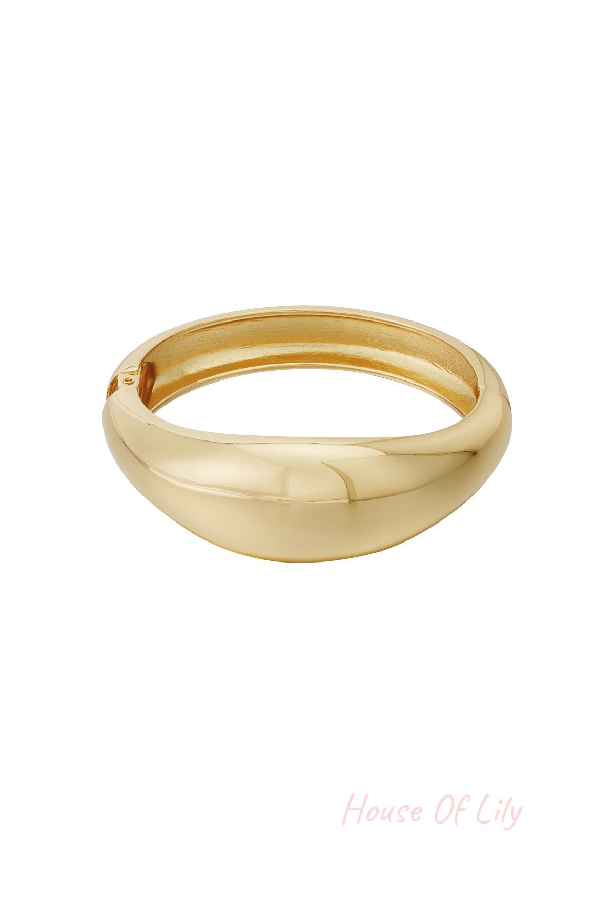 Gold dome-shaped smooth bangle bracelet isolated on white background