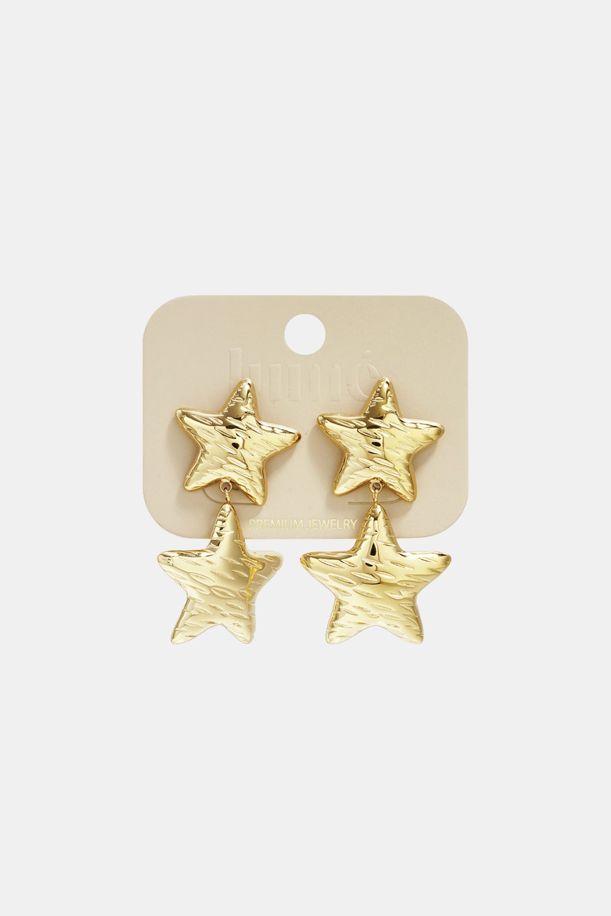 Gold star-shaped double drop earrings displayed on light beige jewelry card labeled 'Lumé Premium Jewelry'