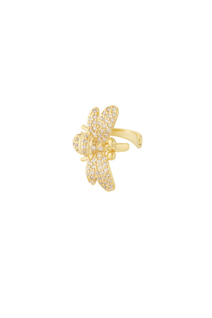 Close-up image of a gold ear cuff shaped like a bee embellished with sparkling zircon crystals