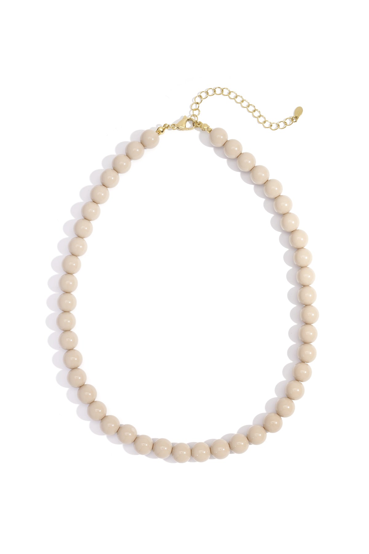 Light beige resin beaded necklace with gold lobster clasp and chain extender on white background