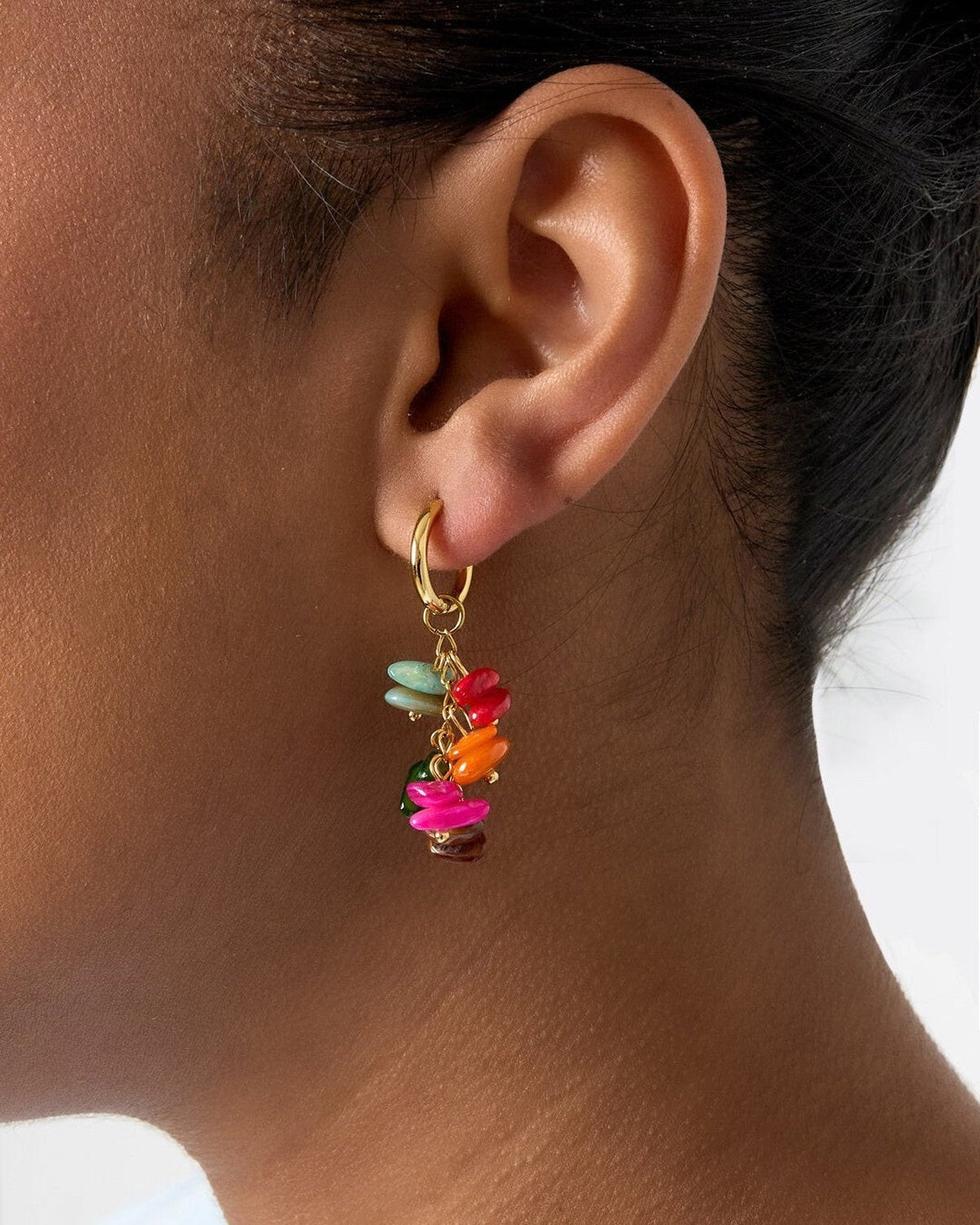 Small hoop earrings with dangling stones and beads
