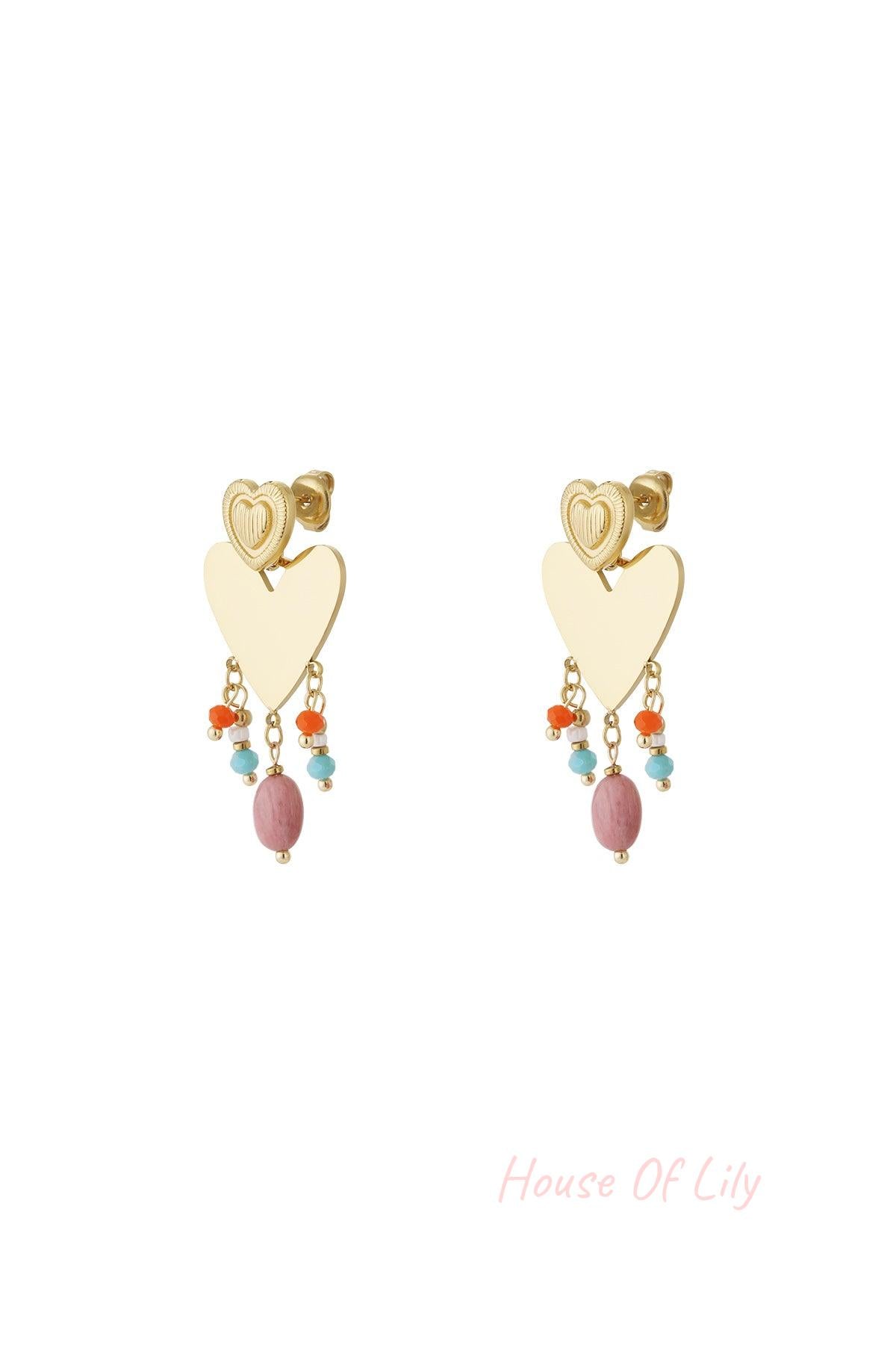 Pair of gold-tone heart drop earrings with colorful pink, orange, and light blue bead charms dangling below a textured smaller heart stud on white background.