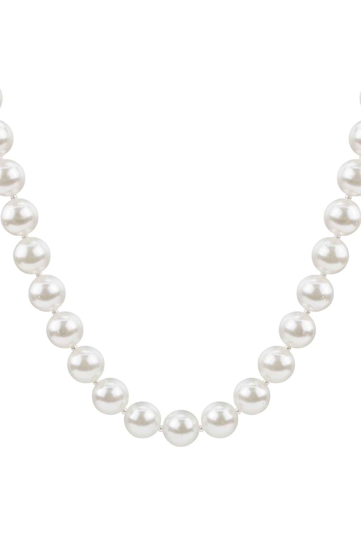 Close-up of classic pearl necklace featuring large glossy white imitation pearls evenly strung in a minimal design