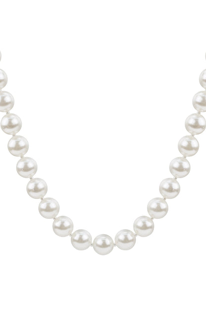 Close-up of classic pearl necklace featuring large glossy white imitation pearls evenly strung in a minimal design