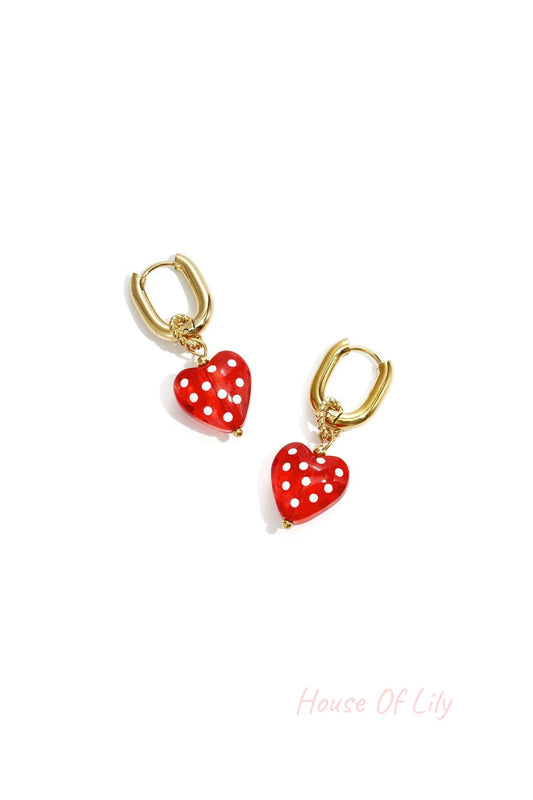 Earrings with dangling hearts with dots