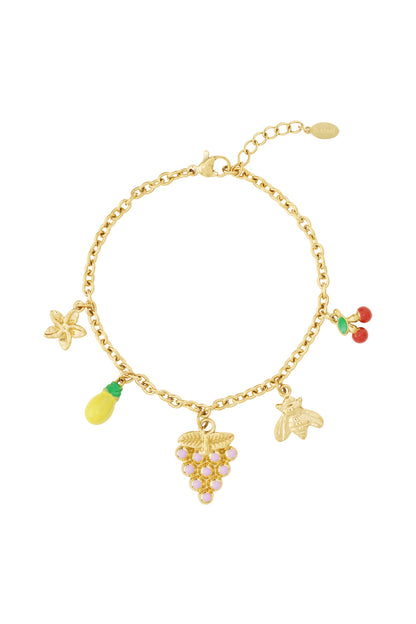 Gold-plated charm bracelet with colorful fruit and bee enamel charms on a white background