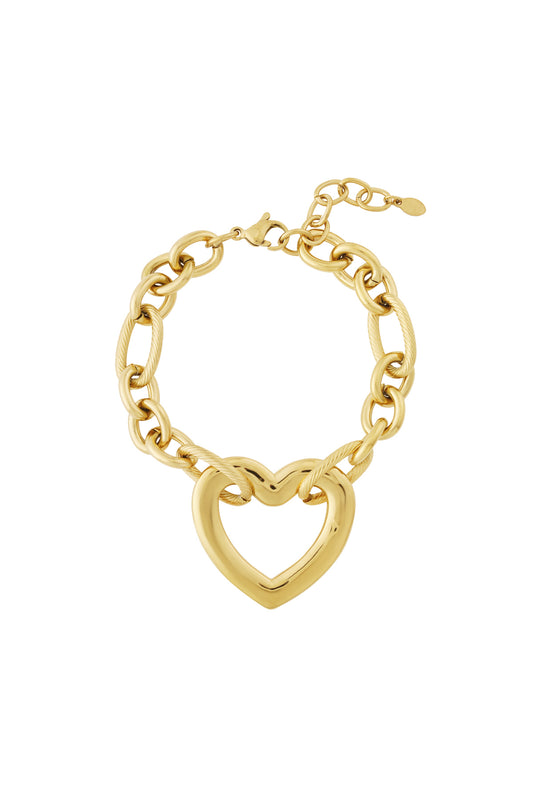 Chunky heart link bracelet in gold with large hollow heart centerpiece and polished chain links, isolated on white background