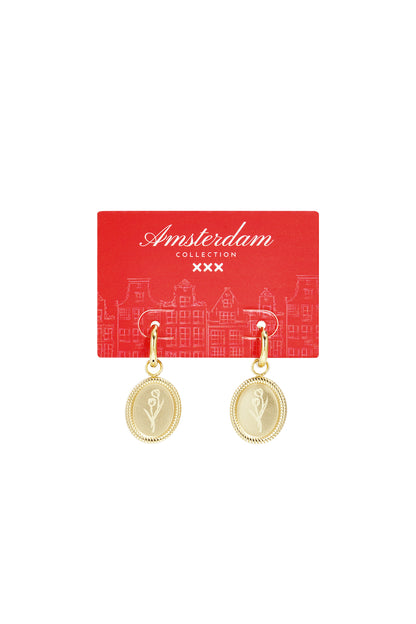 Gold floral oval hoop earrings displayed on a branded red packaging card