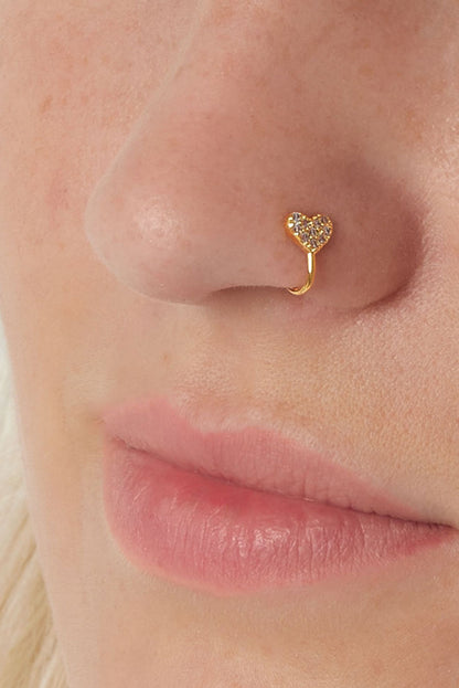 Model wearing the gold-tone heart ear cuff on her nose, showcasing the delicate sparkling zircon heart on the left nostril