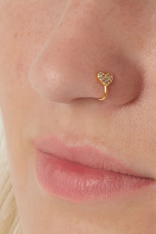Model wearing the gold-tone heart ear cuff on her nose, showcasing the delicate sparkling zircon heart on the left nostril