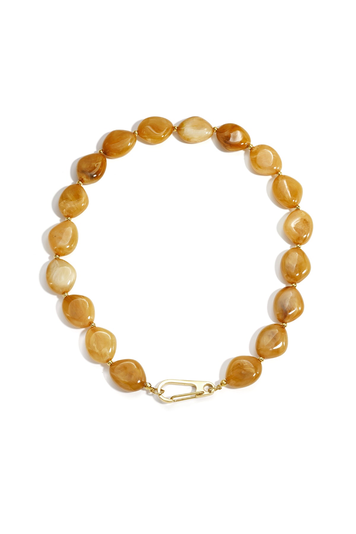 Amber colored chunky resin beaded necklace with gold-tone front clasp and irregular oval beads arranged in a circle