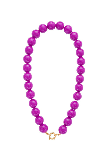 Chunky magenta resin bead necklace with a gold-tone metal spring ring clasp at the front.
