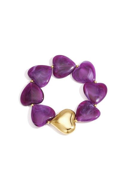 Heart-shaped marbled purple acrylic bead bracelet with gold-tone heart accent on white background