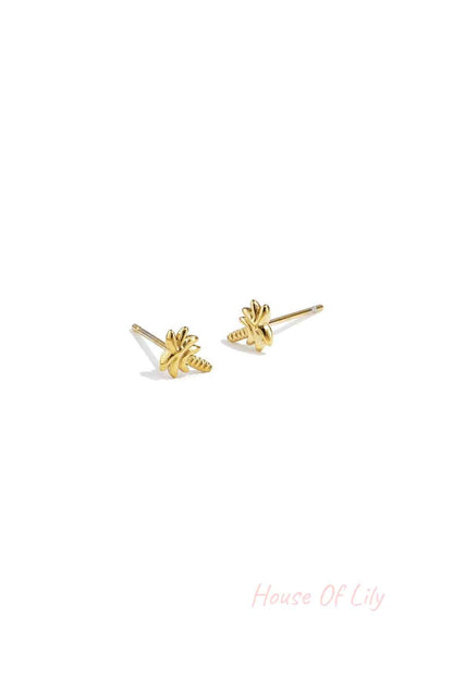 Pair of gold-tone palm tree stud earrings displayed on white background