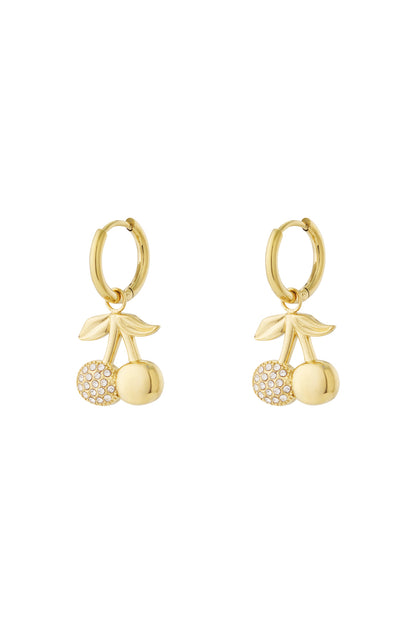 Pair of gold cherry drop earrings with rhinestone accented cherries hanging from smooth hoop earrings on white background