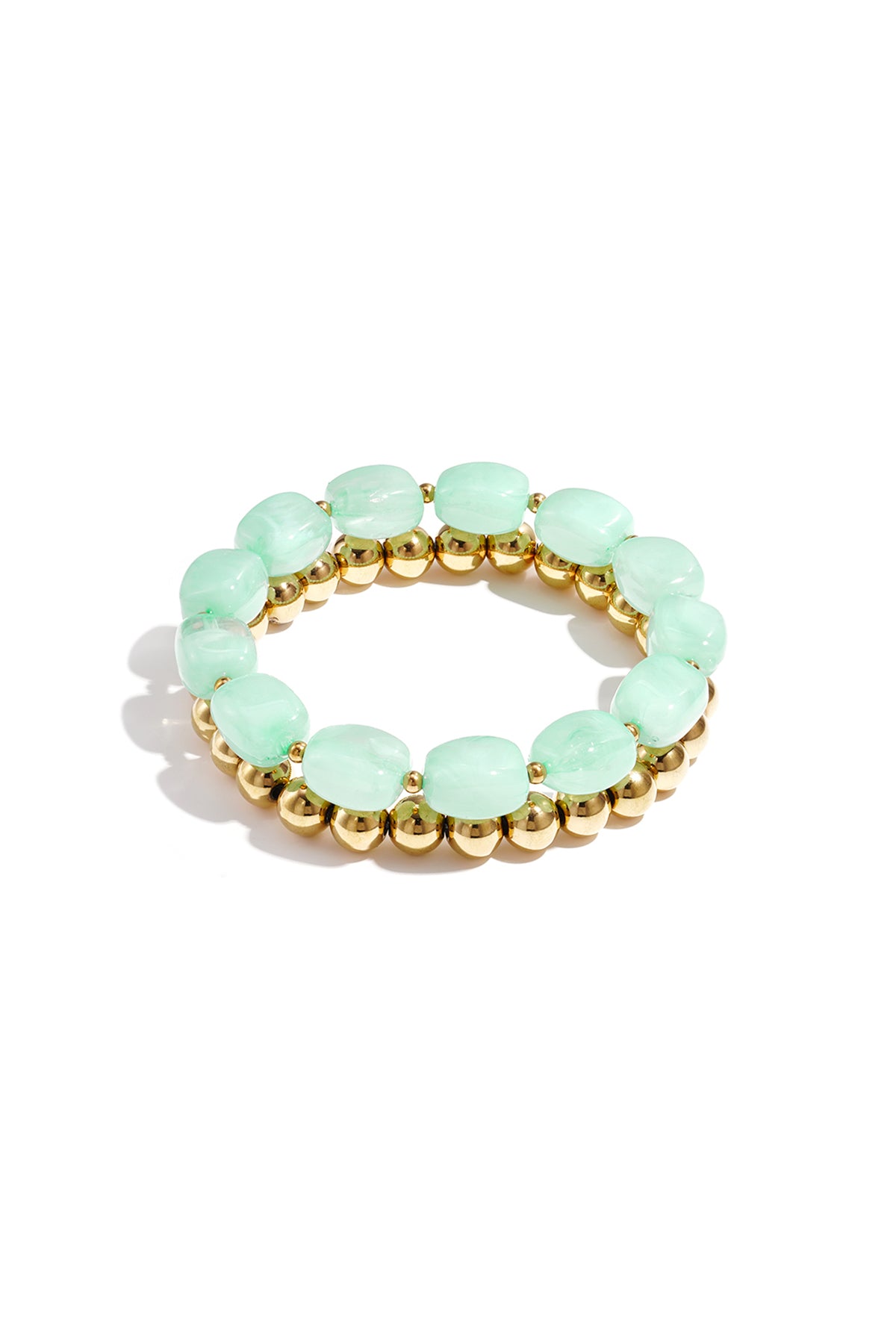 Two stacked bracelets featuring pastel mint green oval beads and polished gold metallic round beads.