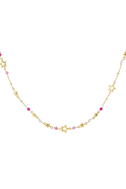 Close-up of gold-toned star charm necklace adorned with alternating pink and white beads on a plain white background