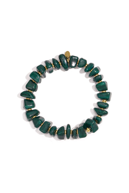 Forest green chunky beaded stretch bracelet with gold spacers displayed in circle