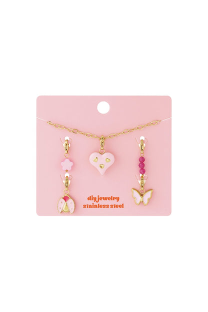 Your Custom Vibe: Gold-tone stainless steel DIY jewelry set with a pink heart, butterfly, and ladybug charms on a card.