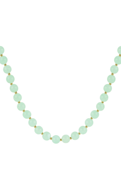 Close-up of mint green glossy acrylic beaded necklace with gold spacers on white background