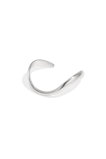 Silver-toned organically sculpted open cuff bracelet with smooth curved design on white background