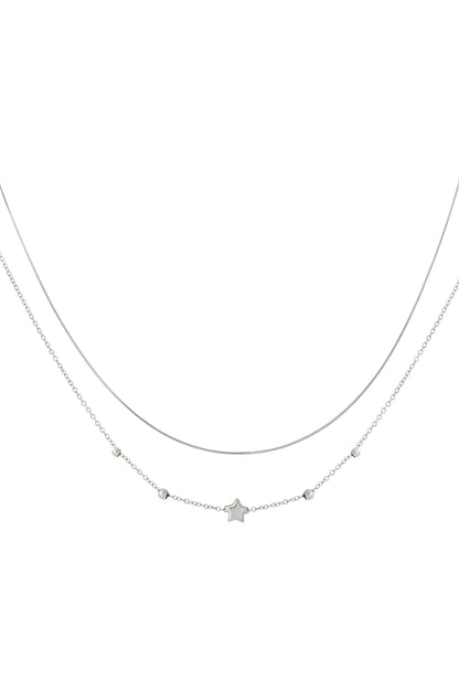 Silver toned double layered necklace featuring a smooth chain and a chain with a small star charm and round beads detail