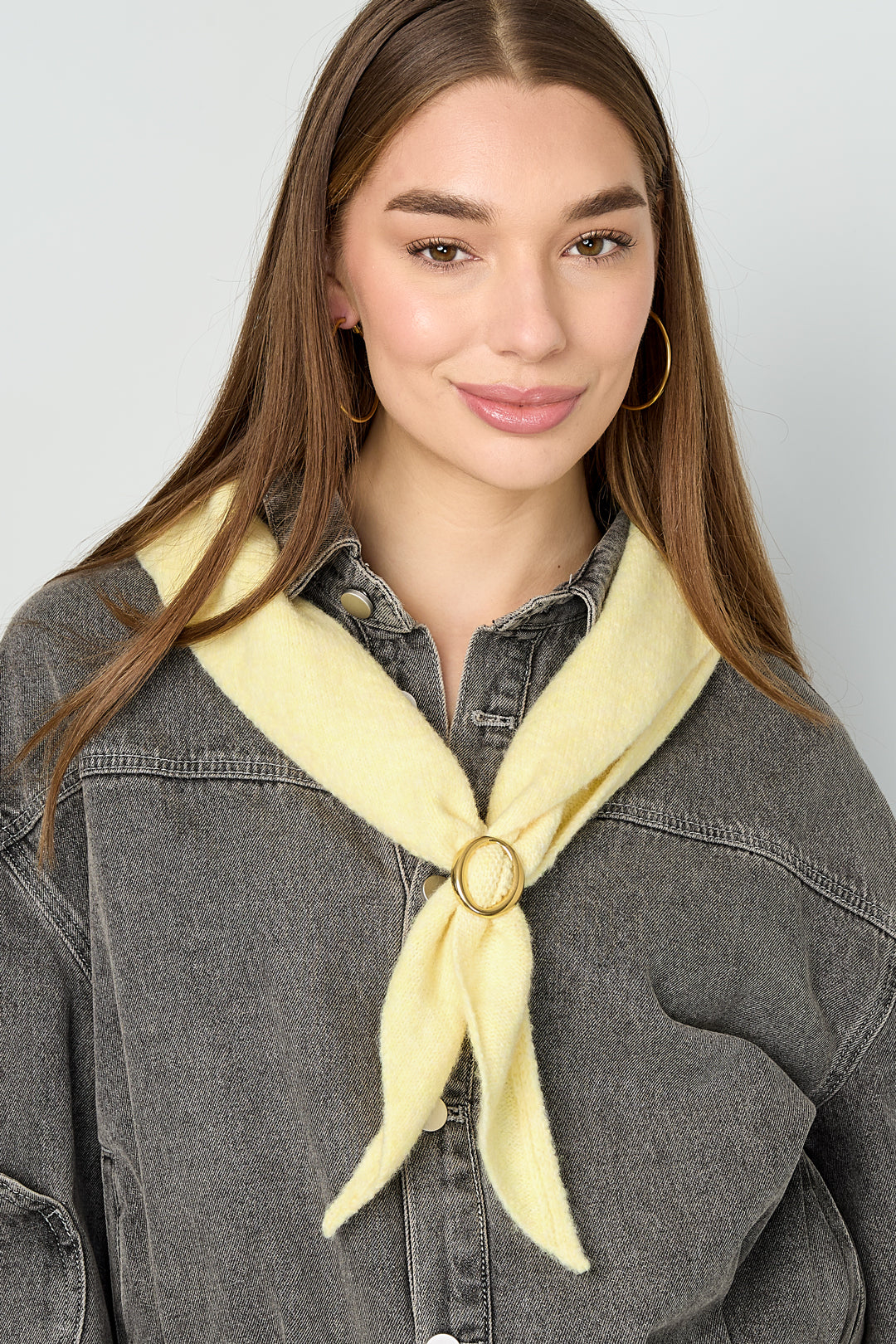 Red knit triangular winter scarf displayed flat on white background