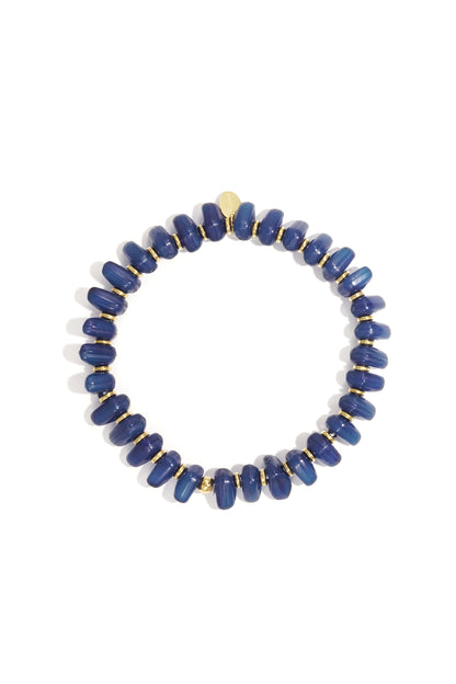 Blue chunky beaded stretch bracelet with gold-tone spacers in a circular arrangement