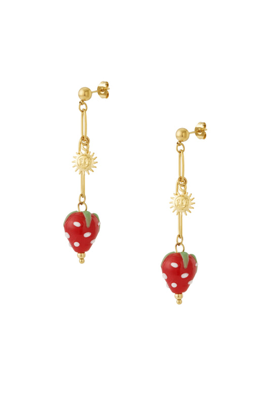 Pair of gold drop earrings featuring sun charms and red enamel strawberry pendants with white dots