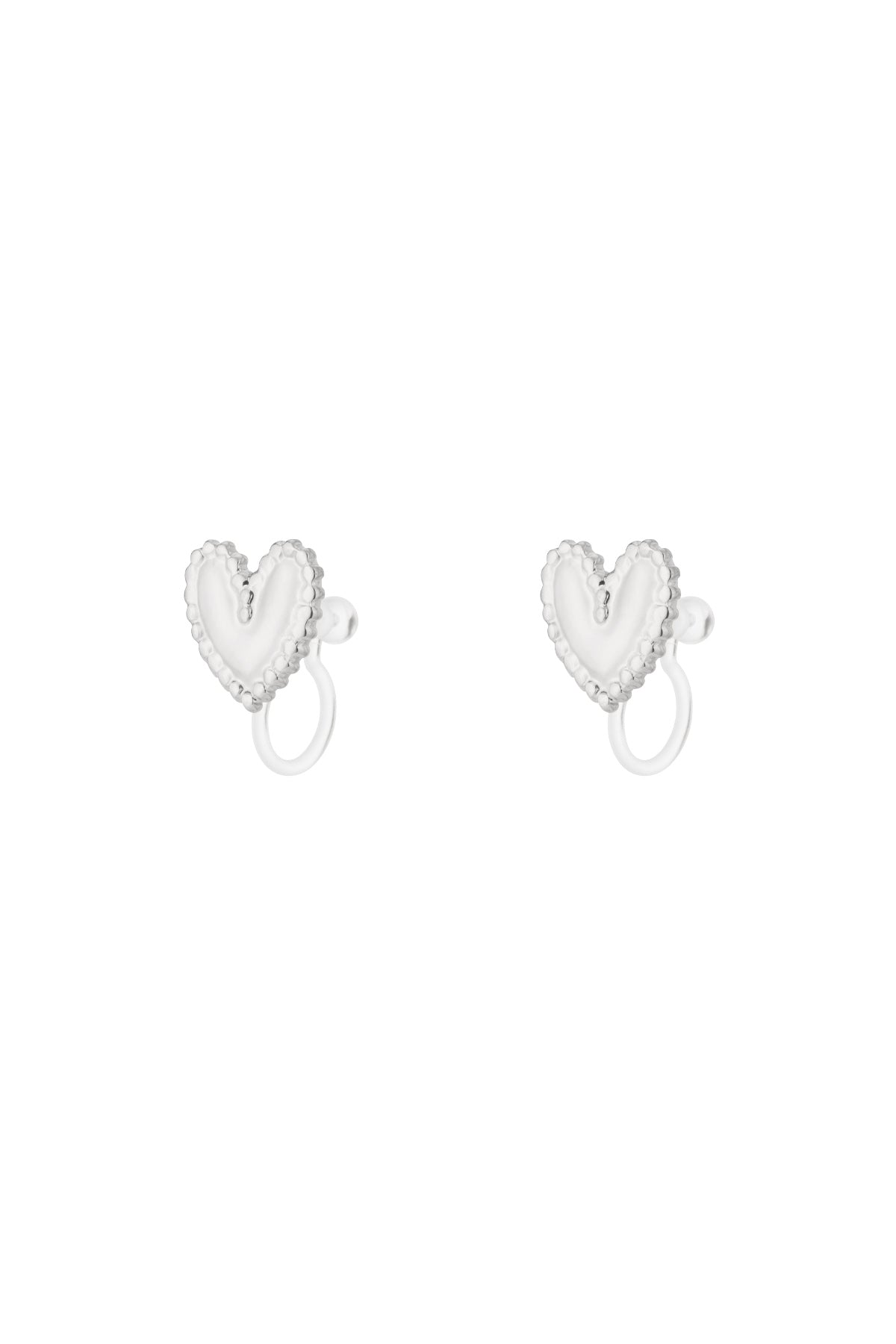 Pair of silver-tone heart-shaped clip-on earrings with delicate beaded edges on white background