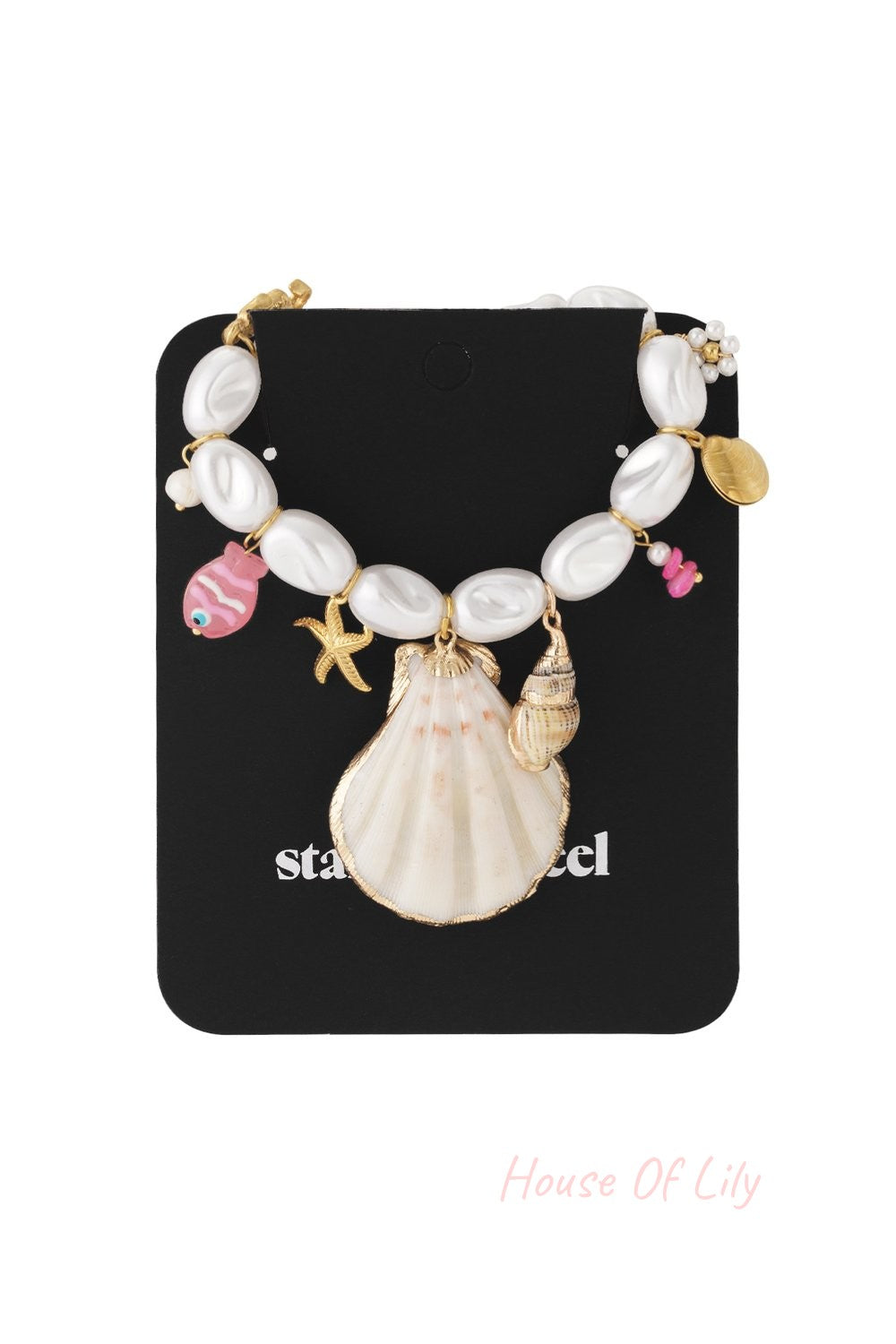 Nautical necklace with white oval pearls, a large seashell charm, and colorful fish and starfish accents on gold chain.