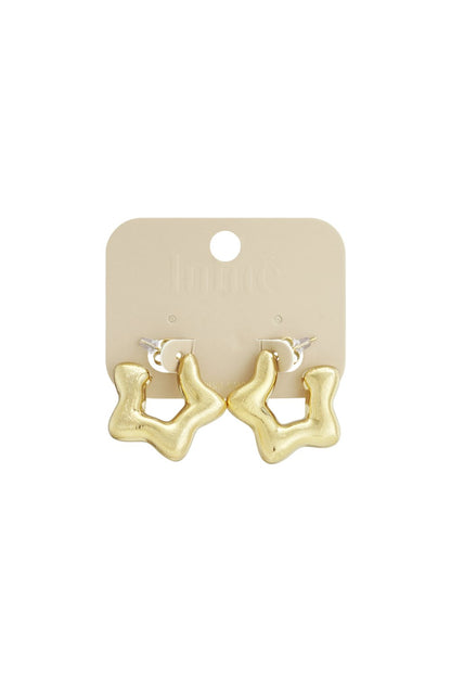 Sculpted gold-tone hoop earrings with an organic, wavy, star-like silhouette on a beige retail display card.