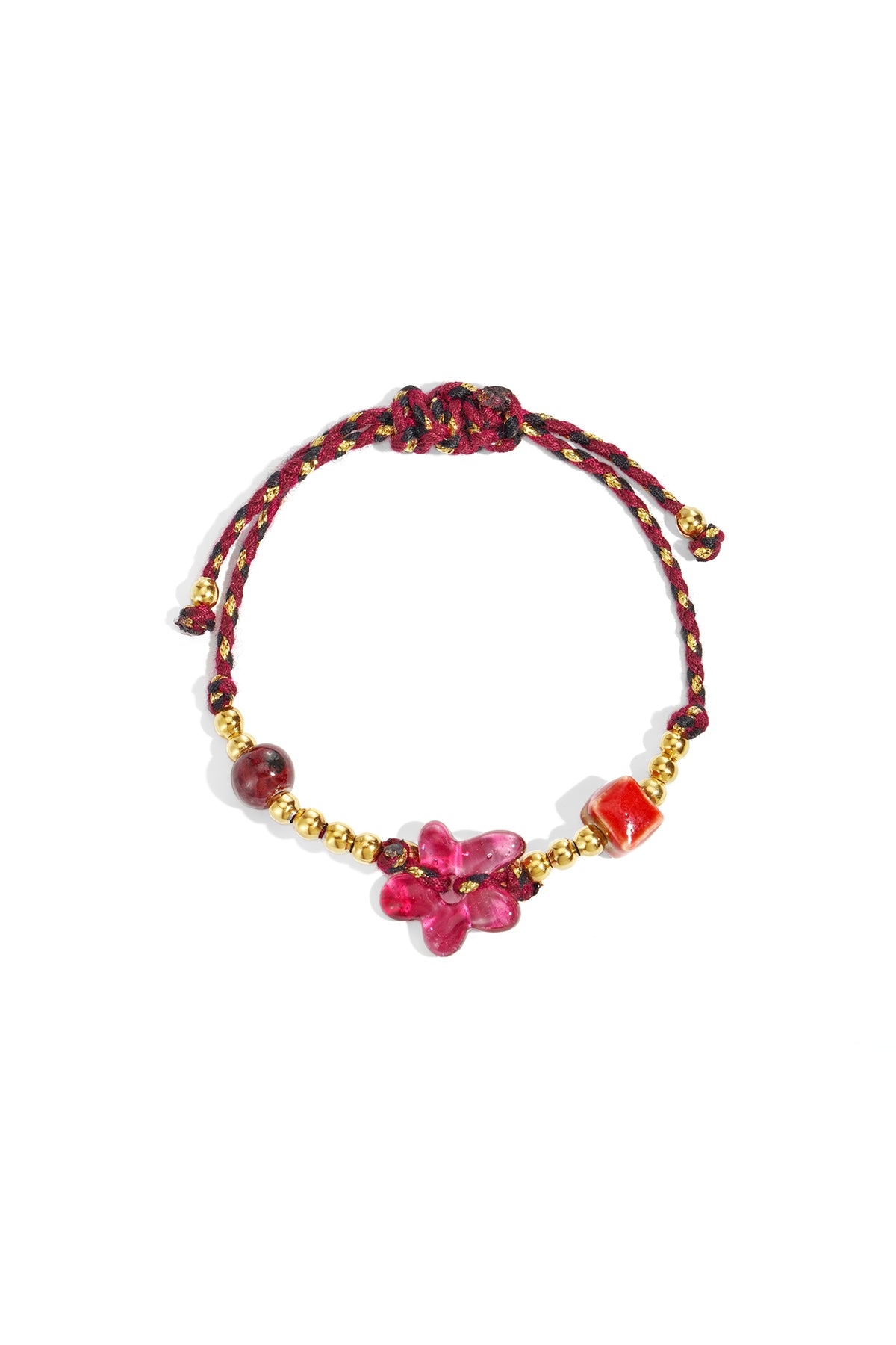 Close-up of a burgundy and gold beaded bracelet with a pink flower-shaped bead centerpiece
