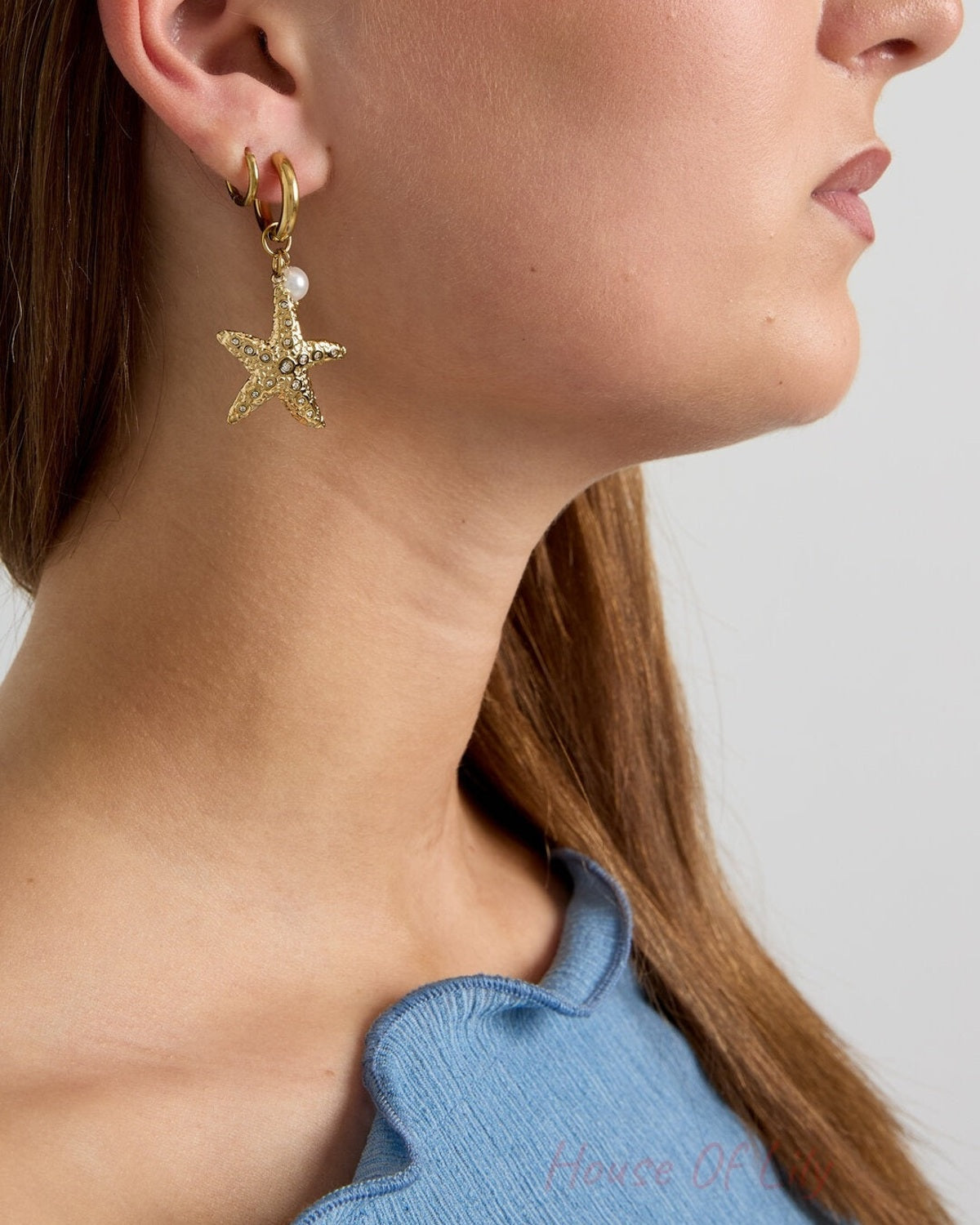 Earrings with starfish and pearl