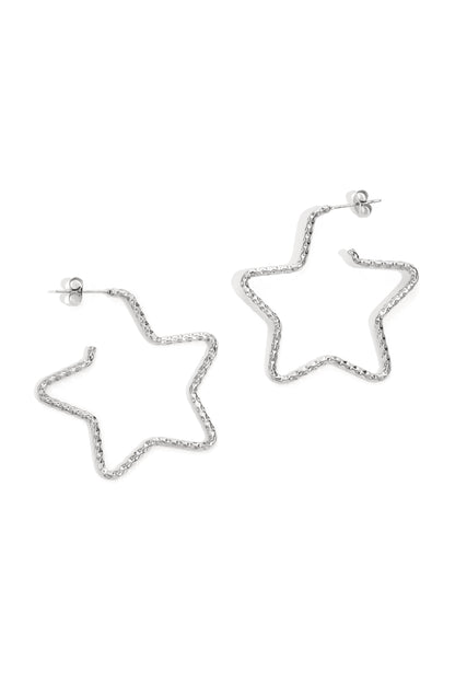 Silver star-shaped textured hoop earrings displayed on white background