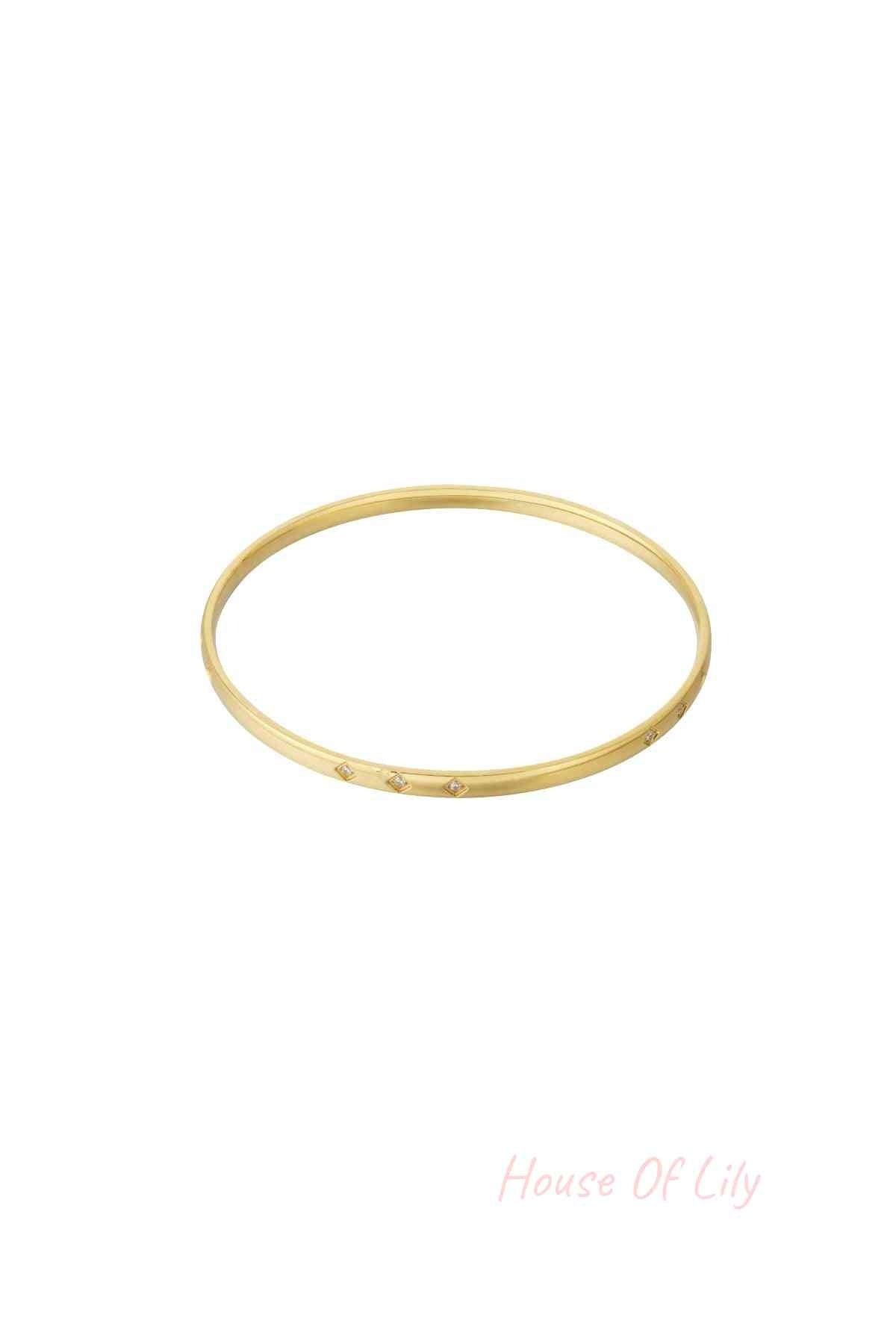 Gold mini diamond bangle with small rhinestone accents displayed on white background