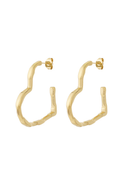 Pair of gold wavy heart hoop earrings displayed on white background
