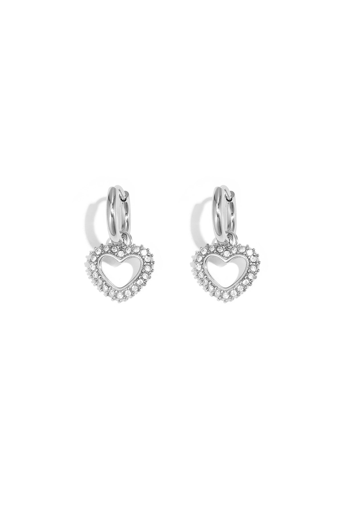 Silver-tone heart-shaped rhinestone drop earrings with smooth hoop closure on white background