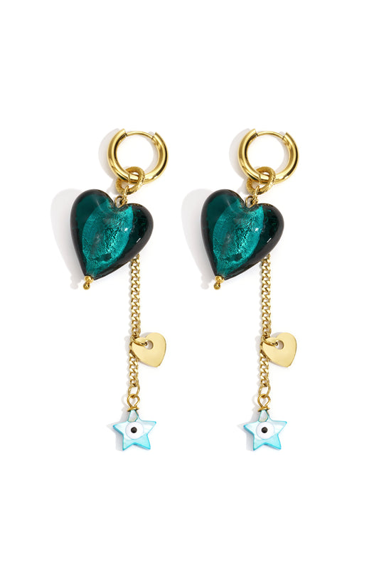 Pair of gold-tone drop earrings with emerald-green heart charms hanging from hoops, gold chain with small gold heart and blue star pendants