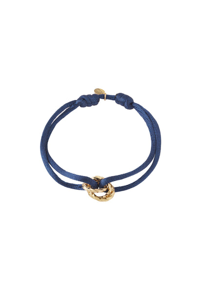 Navy knot charm bracelet with gold-plated twisted knot pendant on white background