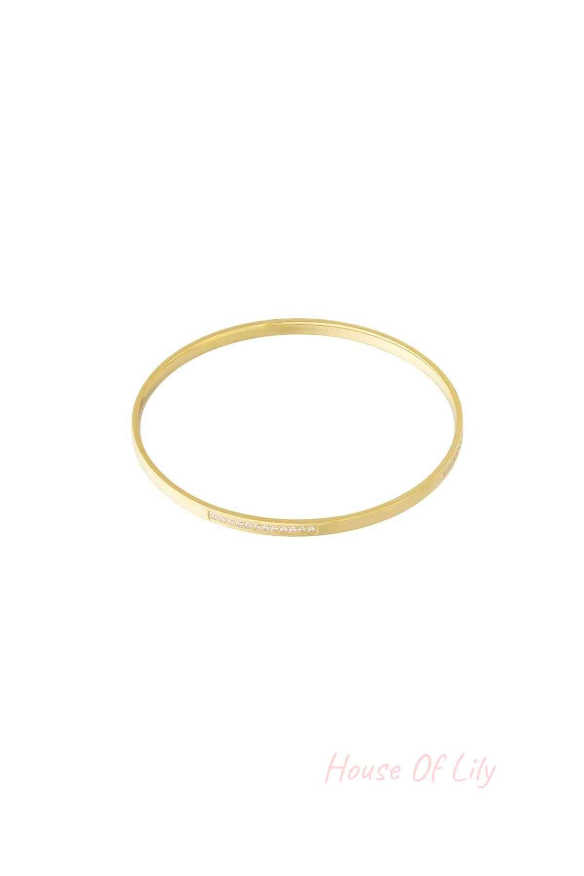 Gold thin rhinestone bangle bracelet isolated on white background