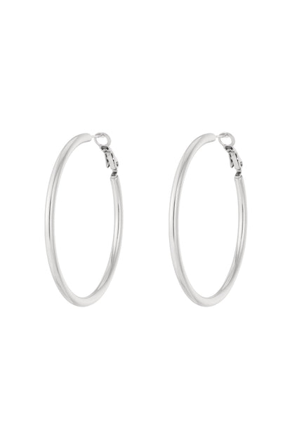 Top view of silver hoop earrings with open hinge clasp