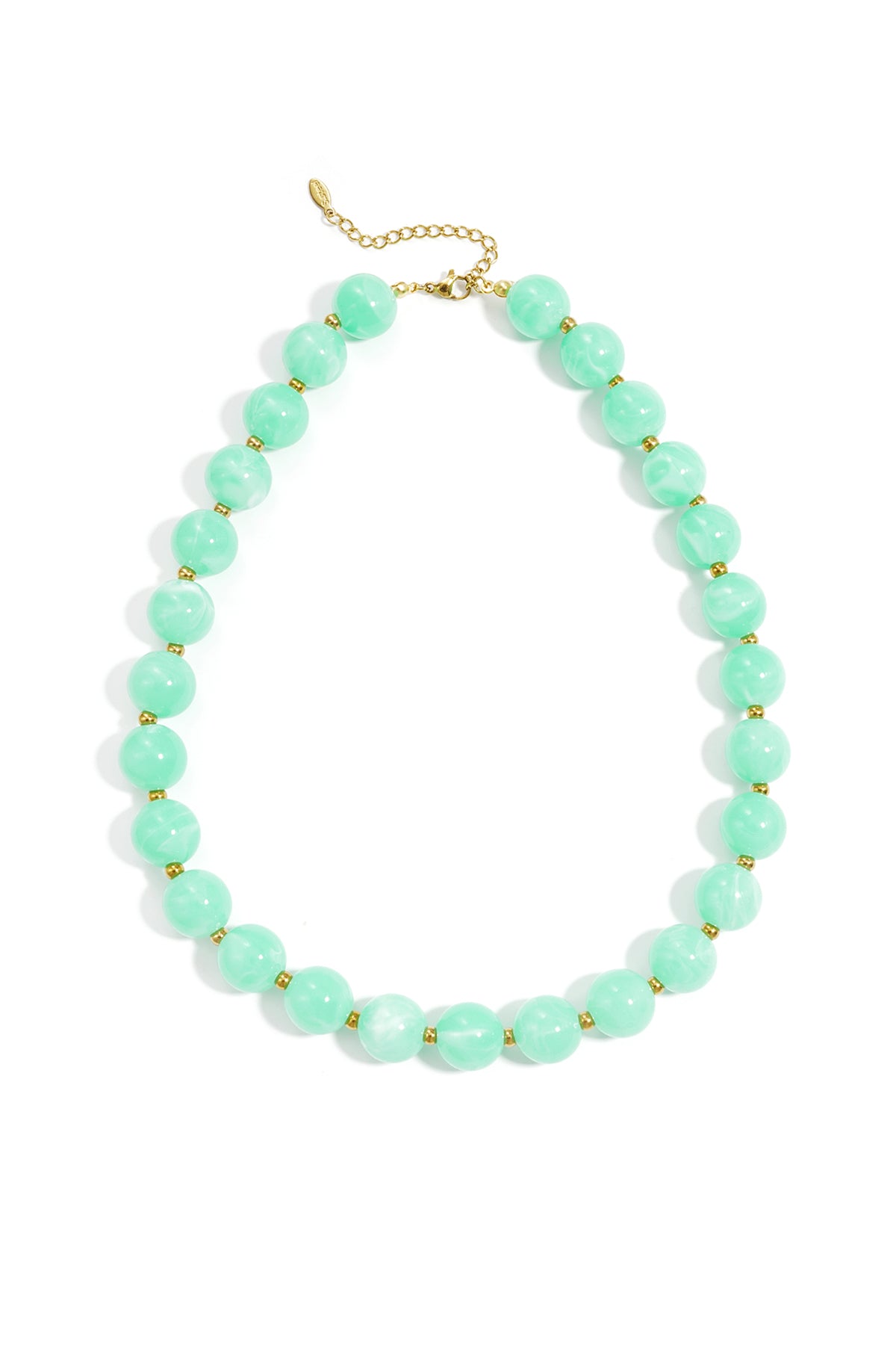 A statement necklace featuring large, round, mint green marbled beads separated by small gold spacers on a gold chain.