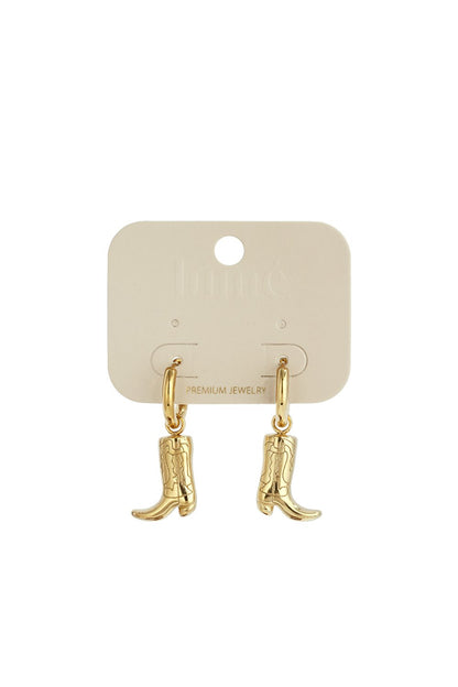 Bootin' Around earrings: Gold-toned hoop earrings featuring dangling cowboy boot charms on a display card.