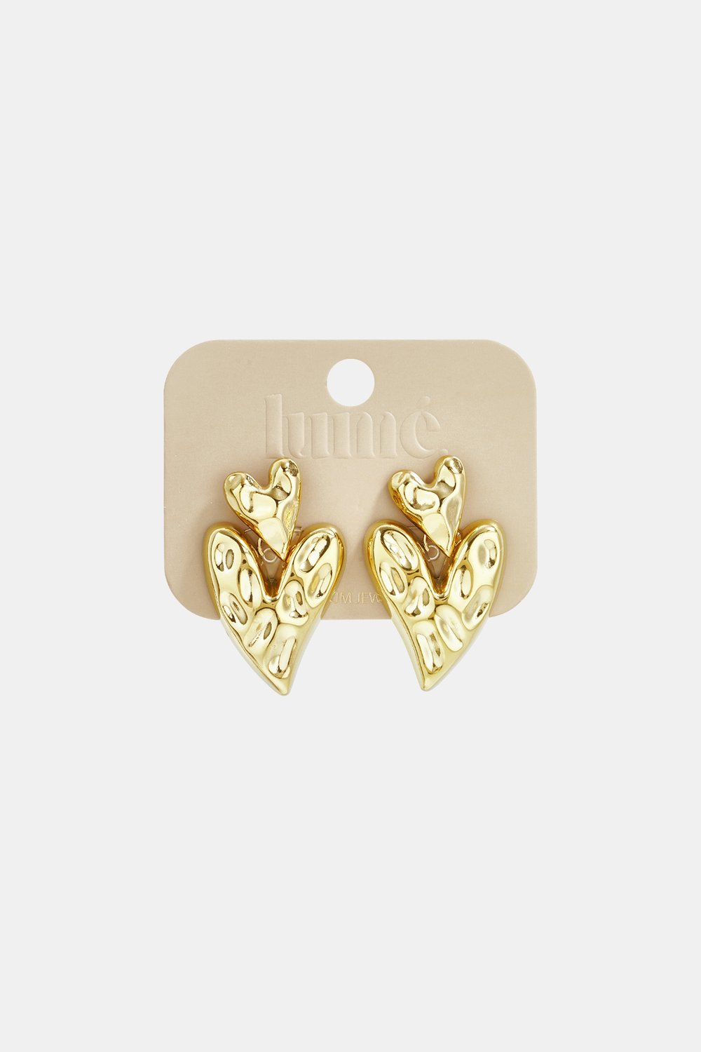 Gold, hammered-texture double heart drop earrings on a branded display card.