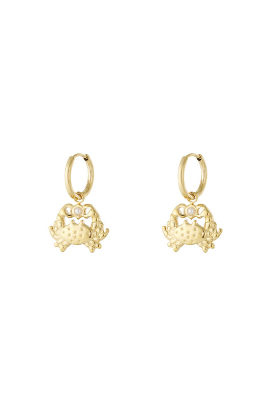 Pair of gold crab-shaped drop hoop earrings with star engravings and pearl detail.