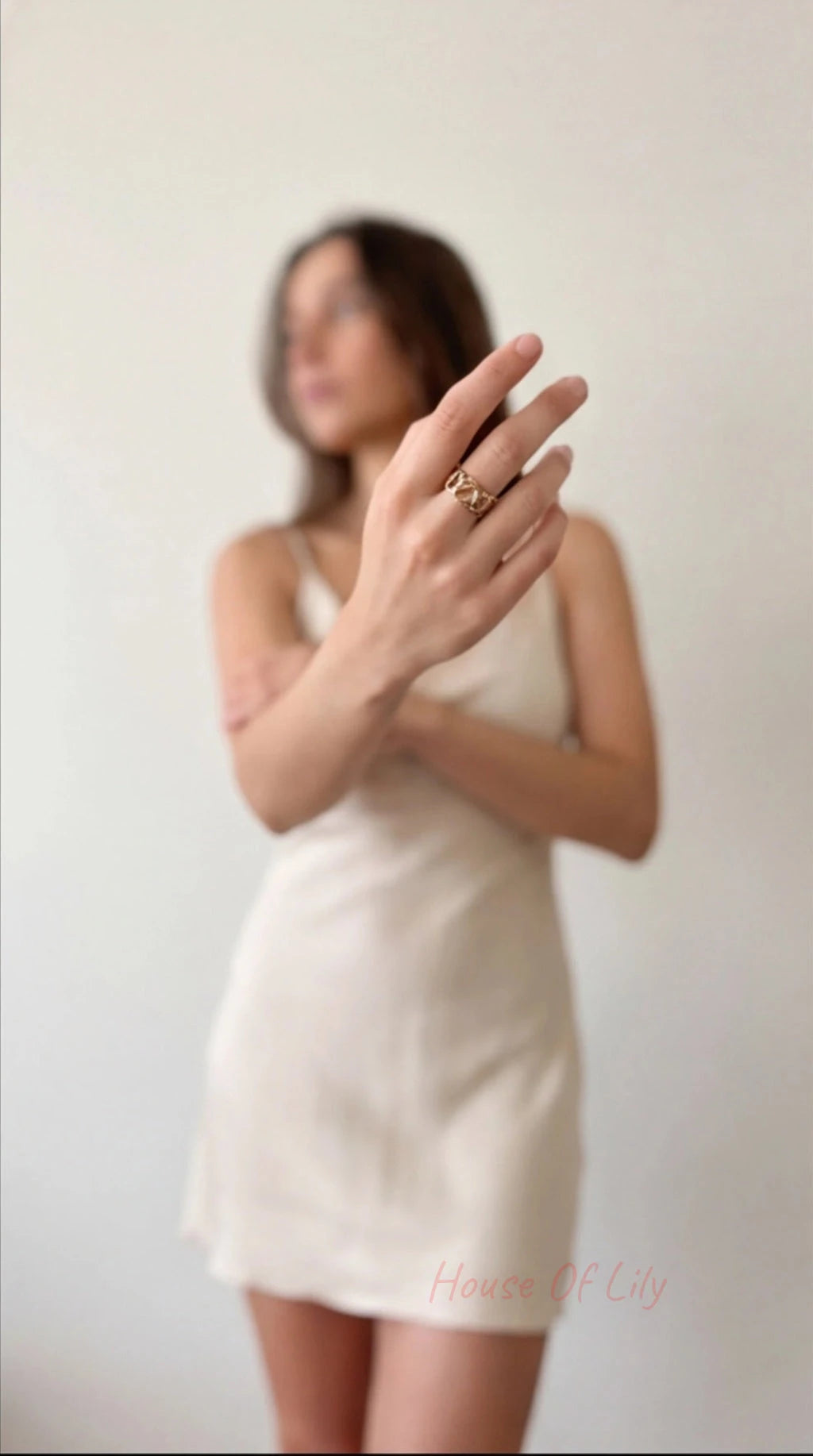 Woman wearing a white dress with a blurred background