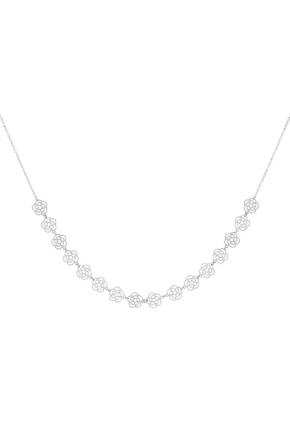 Silver floral chain necklace with small flower cut-out charms laid flat on white background