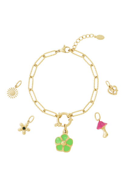 Gold chain bracelet with detachable colorful enamel charms of flowers, hearts, and a mushroom on a white background